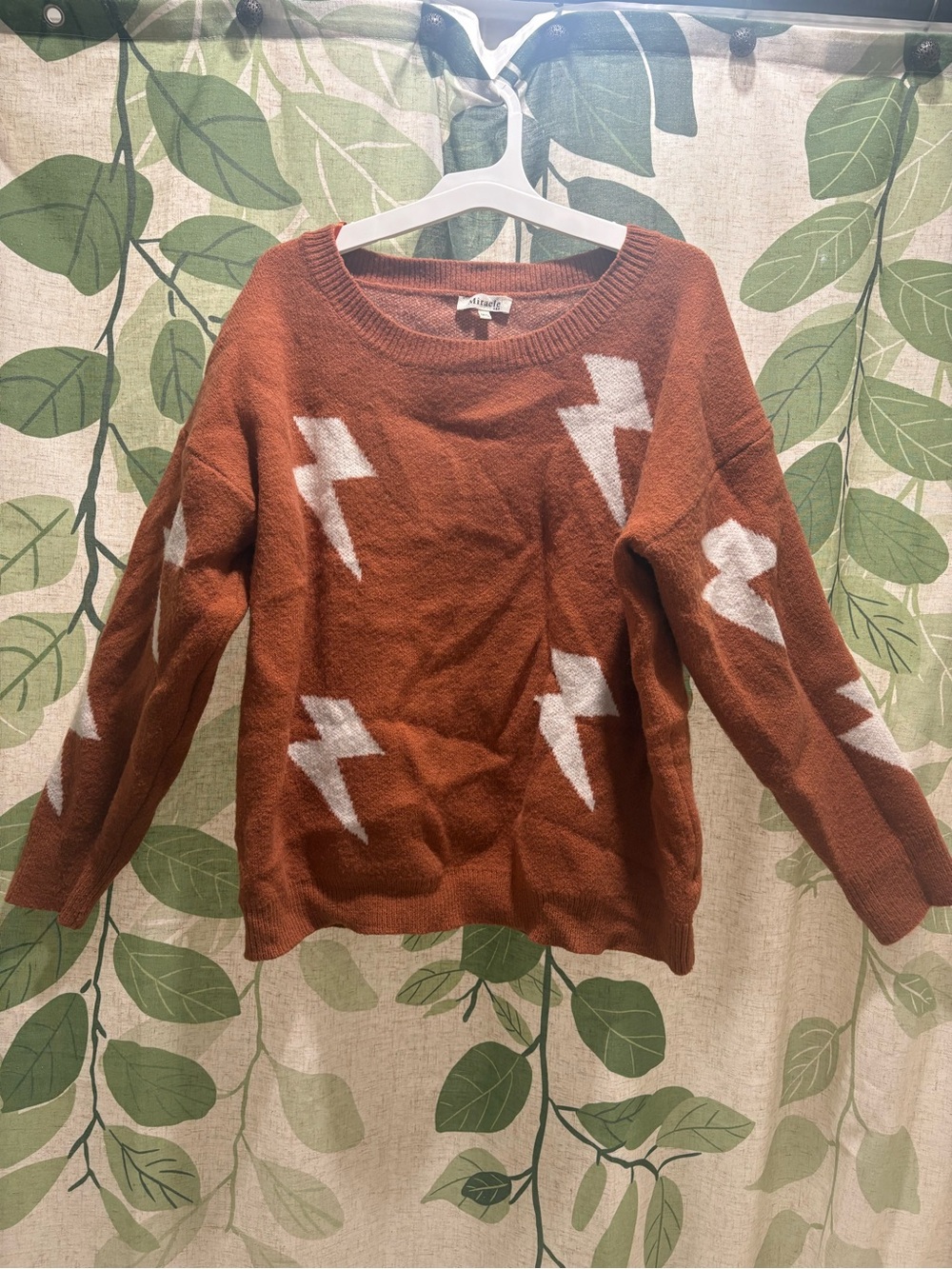 Miracle Rust Sweater with White Lightning Bolt Motif
